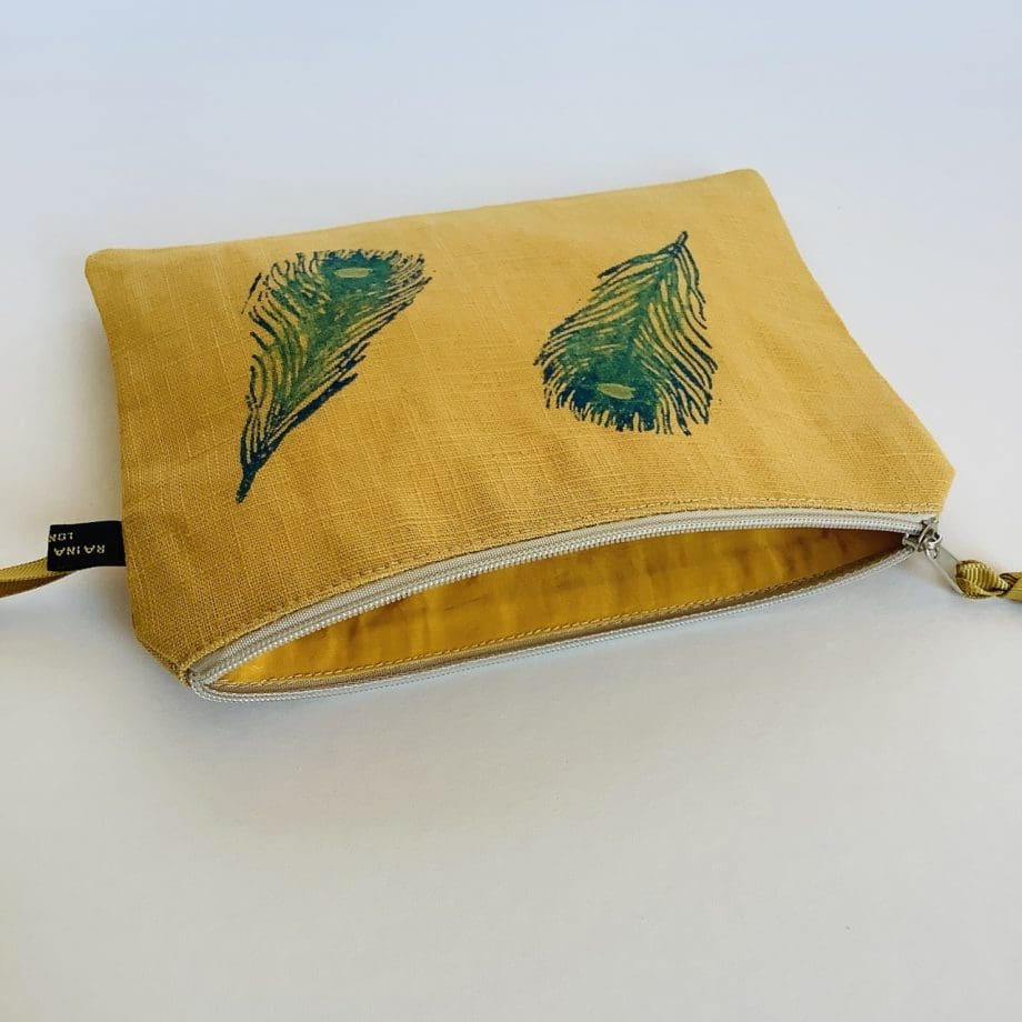 Linen Zip-Up Pouch - curry yellow with peacock feathers motif