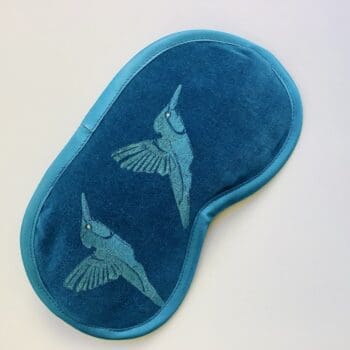 Luxury velvet lavender infused eye mask with hummingbirds hand printed design in blue with golden shimmer wings