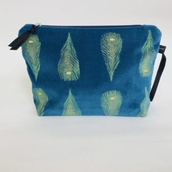 Luxury teal velvet makeup bag with yellow peacock feathers print with golden shimmer